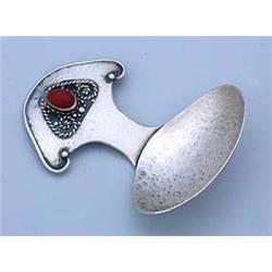 An Arts and Crafts caddy spoon, possibly by Amy Sandheim, with oval hammer-textured bowl and shaped.