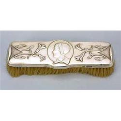A William Hutton & Sons silver-backed clothes brush, embossed with the profile head of a girl wearin