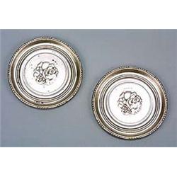 A pair of Georg Jensen silver wine glass coasters, of circular shape with beaded rims and embossed i