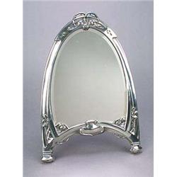 A German pewter easel mirror, attributed to Kayser, of arched shape embellished at the top with rose