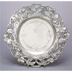 A W.M.F. circular tray, with a broad rim embellished with an openwork design of the profile head and