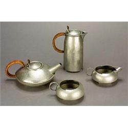 A Liberty & Co. 'Tudric Pewter' four-piece teaset, designed by Archibald Knox, comprising a compress