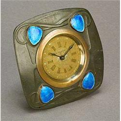 A Liberty & Co 'English Pewter' and enamelled easel Timepiece, designed by Archibald Knox, the pewte