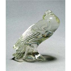A Warren-Kessler glass model of a pidgeon, the creature rests on a circular base with its tail feath
