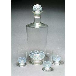 'Pouilly' A Lalique glass decanter and stopper of shouldered cylindrical shape, moulded around the l