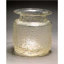 An Iittala glass vase, designed by Timo Sarpaneva, of eliptical section with a flared neck and havin