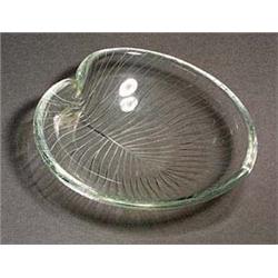 A Tapio Wirkkala leaf-shaped glass bowl, the shallow vessel in clear glass with finely engraved radi