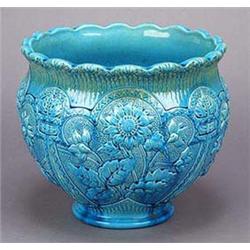 A Burmantofts Faience jardiniere, of globular shape with flared slightly undulating rim, moulded in.