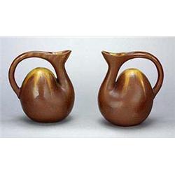 A pair of 'Aesthetic Movement' pottery ewers, although unmarked the appearance and design are attrib