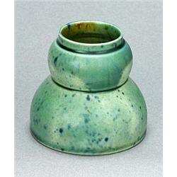 A small Linthorpe Pottery vase, designed by Dr. Christopher Dresser, of double-gourd form with a fla