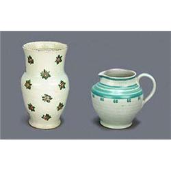 A Carter's Poole semi-stoneware baluster shaped vase, painted with sprays of flowers in red and gree