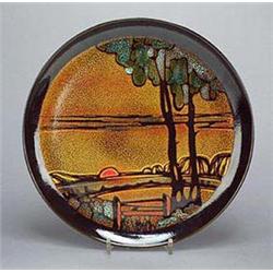 A Poole Pottery 'Aegean' circular wall plate, designed and decorated by Carolyn Wills, showing a lan