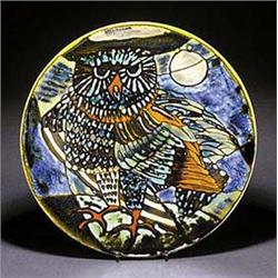 An impressive Poole Pottery 'Delphis' circular wall plate, painted with a large owl perched on a bra