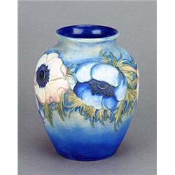 A Moorcroft oviform vase, tube-lined and painted in pale pink, blue and olive-green with anemones an