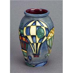 A Moorcroft 'Balloons' vase (1999),  tube-lined with a series of hot air balloons picked out in soft