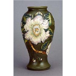 A Moorcroft 'Gustavia'  baluster vase (1999), tube-lined and painted in naturalistic colours with a.