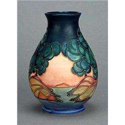 A Moorcroft 'Mamoura' vase (1995), of pear shape tube-lined with two islands in beige and red, each.