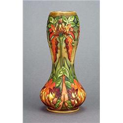 A Moorcroft 'Flame of the Forest' vase (1998), of waisted oviform, tube-lined with exotic floewrs an