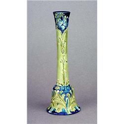 A Moorcroft Macintyre 'Florian Ware' candlestick, with bell-shaped base and slender neck tube lined.