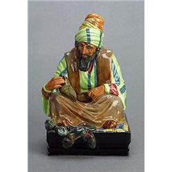 'Cobbler' (HN1706) A Royal Doulton figure, by C.J.Noke, 20.5cm. high, (1935-1969)(see illustration).