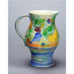 A Royal Doulton Brangwyn Ware 'Harvest' pattern jug of oviform with strap handle painted in colours.