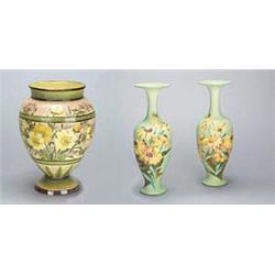 A pair of Doulton Faience vases, painted by Emily J. Gillman, of oviform with trumpet necks, showing