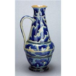 An early Doulton Lambeth stoneware ewer, by Arthur Barlow, of oviform with tapering neck and loop ha