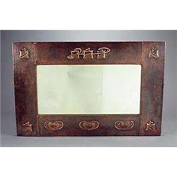 An Arts and Crafts large rectangular copper-faced wooden wall mirror, possibly retailed through Libe