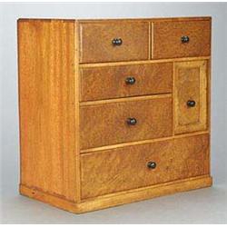 A Burr-wood collector's small cabinet, of upright rectangular shape having a series of short drawers