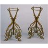 Image 1 : A pair of Art Nouveau bronze fret-work stands, each formed from two flat sections, cut in a sinuous.