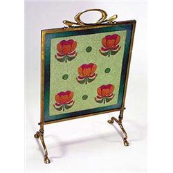 An Art Nouveau brass and glass beaded firescreen, the central panel showing stylised florets in colo