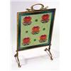 An Art Nouveau brass and glass beaded firescreen, the central panel showing stylised florets in colo