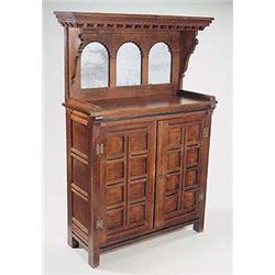 A Gothic oak chiffonier, the design attributed to A.W. Blomfield, as shown in Eastlake's 'Hints on H