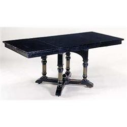 A late 19th century extending ebonised table, the rectangular top with apron below, supported by sol