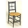 A pair of Morris & Co. ebonised 'Sussex' chairs, with open star-like backs, oval rushed seats, on tu