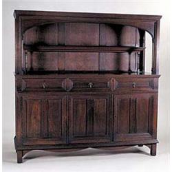 A Morris & Co. dark-coloured walnut sideboard c.1890, designed by Philip Webb, the superstructure ha