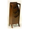 A 'Glasgow School' dark stained oak magazine rack, the plain rectangular back pierced with circular.