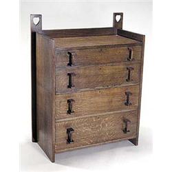 A Liberty & Co. Arts and Crafts oak chest of drawers, designed by Leonard Wyburd, having a short bac