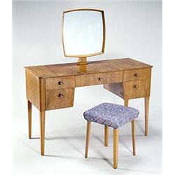 A Russell Workshops walnut-veneered bedroom suite, comprising a stylish dressing table with hinged m