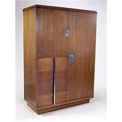 A stylish Art Deco gentleman's compendium, divided into a wardrobe flanked by a small cupboard with.