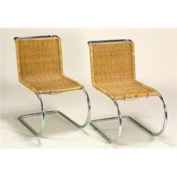 A pair of tubular metal and wicker cantilever chairs, the design by Mies Van der Rohe, the chromium.