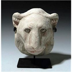 An Egyptian Polychrome Stucco Model of the Head of a Lioness