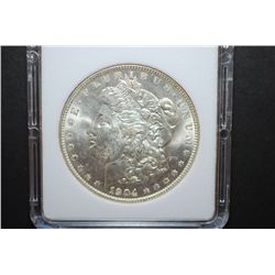 1904-O US Silver Morgan $1; MCPCG Graded MS63; EST. $50-70