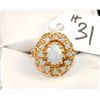 Image 1 : VINTAGE 14K YELLOW GOLD OPAL RING SET WITH  ONE LARGE OVAL CAPACHON OPAL AND SURROUNDED  WITH TWELVE