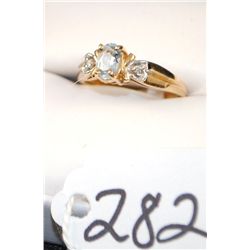 WOMENS BLUE TOPAZ AND DIAMOND RING WITH ONE  OVAL CUT BLUE TOPAZ AND TWO ACCENT DIAMONDS  SET IN 10K