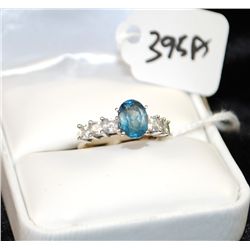 10K WHITE GOLD LADIES RING WITH ONE OVAL CUT  BLUE STONE AND SIX PRINCESS CUT CLEAR SIDE  STONES