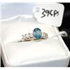 Image 1 : 10K WHITE GOLD LADIES RING WITH ONE OVAL CUT  BLUE STONE AND SIX PRINCESS CUT CLEAR SIDE  STONES