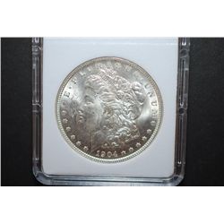 1904-O US Silver Morgan $1; MCPCG Graded MS62; EST. $50-60