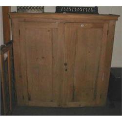 A large C19th pine cupboard with shelved interior