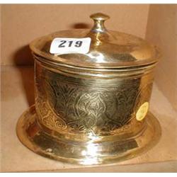 A c1900 oval brass Eastern tea caddy with etched decoration